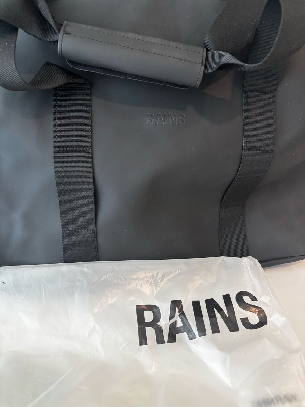 Rains small Black Waterproof Duffel Bag - Minimalist Men's Travel Carryall